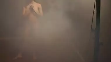 Nude Indian chick fools around during XXX photo shoot in strange room