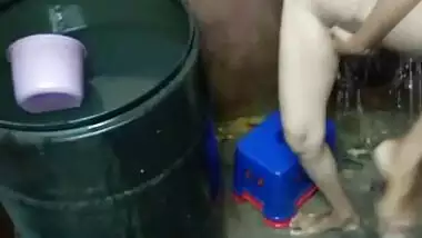 Slim figured Indian girl making her bathing selfie