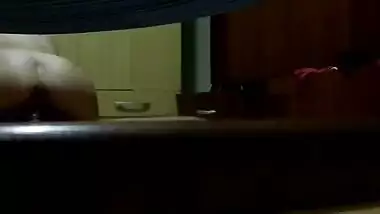 Wearing night suit in front of her husb