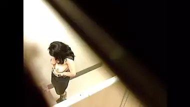 Young college girl chaging in dressing room in mall caught voyuer