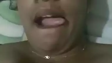 Indian aunty with sexy full lips takes big natural boobs out in bed