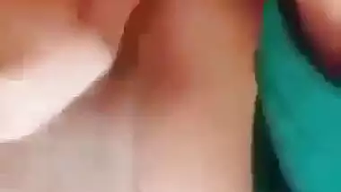 Horny girl squeezes her boobs and fingers her hairy pussy