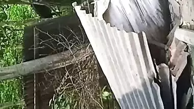 Village neighbor girl outdoor bath caught through hole